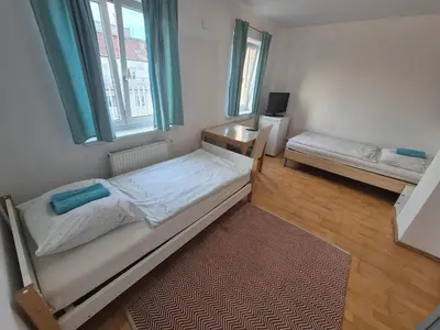Ein Bett oder Betten in einem Zimmer der Unterkunft Vienna Room Nr 12