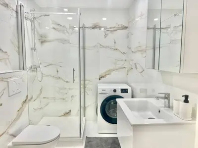Ein Badezimmer in der Unterkunft City Suites of BLE