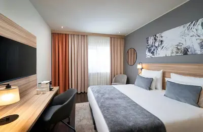 Ein Bett oder Betten in einem Zimmer der Unterkunft Leonardo Hotel Vienna Hauptbahnhof