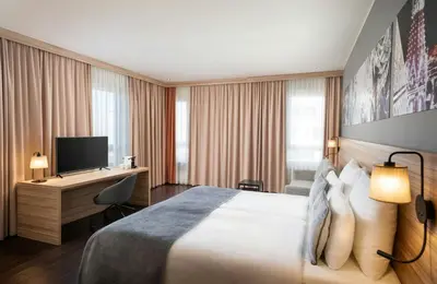 Ein Bett oder Betten in einem Zimmer der Unterkunft Leonardo Hotel Vienna Hauptbahnhof