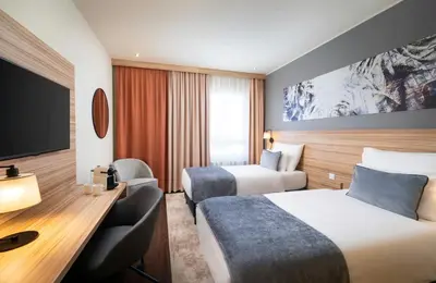 Ein Bett oder Betten in einem Zimmer der Unterkunft Leonardo Hotel Vienna Hauptbahnhof