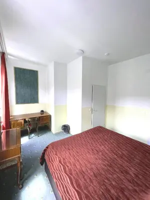 Ein Bett oder Betten in einem Zimmer der Unterkunft Hotel Viki
