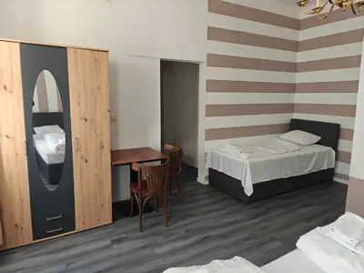 Ein Bett oder Betten in einem Zimmer der Unterkunft Hotel Viki