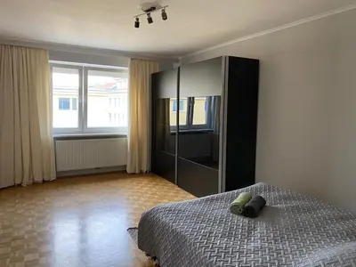 Ein Bett oder Betten in einem Zimmer der Unterkunft Modern and cozy apartment close to city center