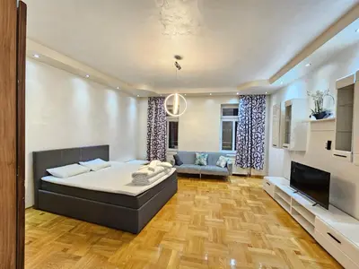Ein Bett oder Betten in einem Zimmer der Unterkunft Schönbrunn Apartments
