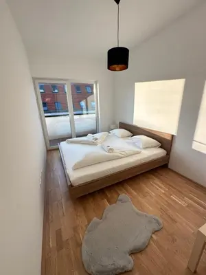 Ein Bett oder Betten in einem Zimmer der Unterkunft New Apartment with Beautiful Balcony 16