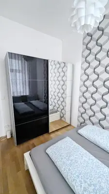 Ein Bett oder Betten in einem Zimmer der Unterkunft Cozy Apartment- 5 Minutes to Danube River