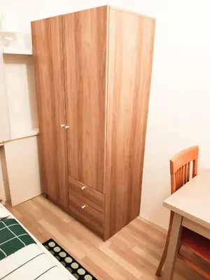 Ein Bett oder Betten in einem Zimmer der Unterkunft FAVORIT-ROOMS , direkt Metro connection U1 to Centralstation , City-Center and Airport