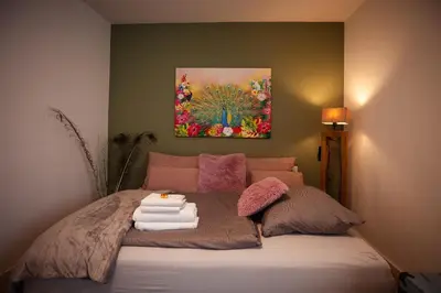 Ein Bett oder Betten in einem Zimmer der Unterkunft Charmantes Haus -Nähe Parndorf-Neusiedl-Wien-HU-SK