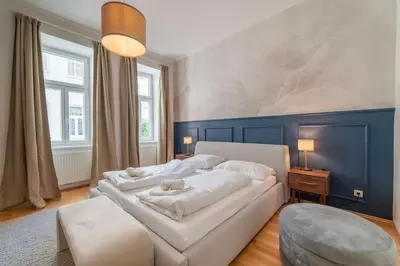 Ein Bett oder Betten in einem Zimmer der Unterkunft josef's home I Vienna Charm Apartment I 02