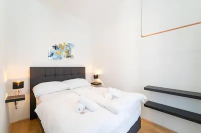 Ein Bett oder Betten in einem Zimmer der Unterkunft josef's home I Comfort Apartment I UNO-City, VIC