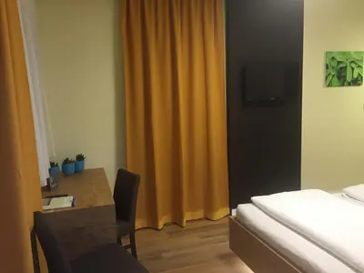 Ein Bett oder Betten in einem Zimmer der Unterkunft Schnepfenhof