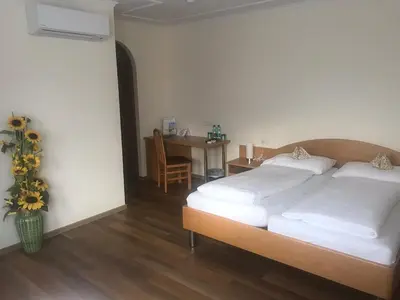 Ein Bett oder Betten in einem Zimmer der Unterkunft Schnepfenhof