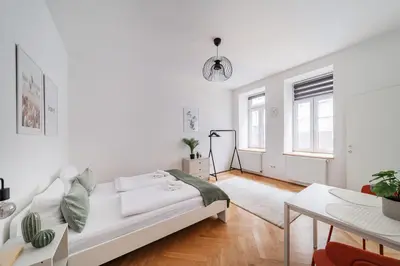 Ein Bett oder Betten in einem Zimmer der Unterkunft Pretty Apartment in Vienna