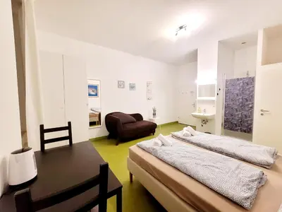 Ein Bett oder Betten in einem Zimmer der Unterkunft Tota K