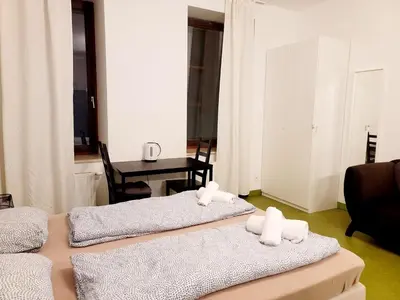 Ein Bett oder Betten in einem Zimmer der Unterkunft Tota K