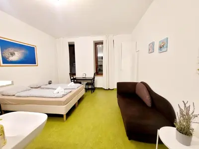 Ein Bett oder Betten in einem Zimmer der Unterkunft Tota K