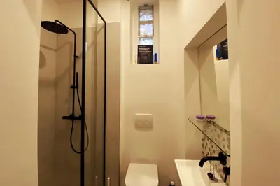 Ein Badezimmer in der Unterkunft Deluxe Apartment mit Suite