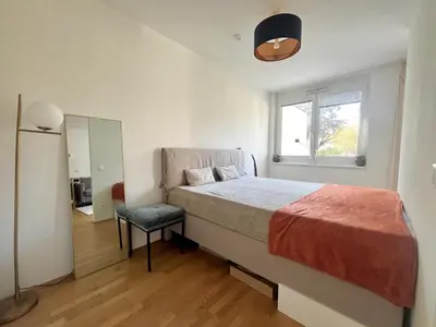 Ein Bett oder Betten in einem Zimmer der Unterkunft Wohnung mit Garten in 1230 Wien