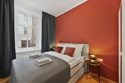 Ein Bett oder Betten in einem Zimmer der Unterkunft Grand Urban Residence Apartment
