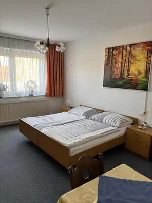 Ein Bett oder Betten in einem Zimmer der Unterkunft Pension Eicher