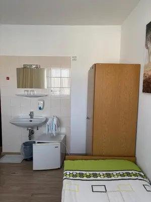Ein Bett oder Betten in einem Zimmer der Unterkunft Pension Eicher