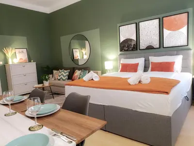 Ein Bett oder Betten in einem Zimmer der Unterkunft Apartments Deluxe zum Wohlfühlen