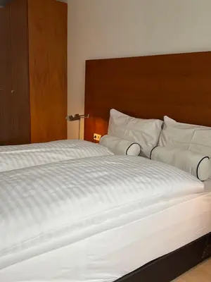 Ein Bett oder Betten in einem Zimmer der Unterkunft EQbase Vienna City Apartments