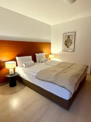 Ein Bett oder Betten in einem Zimmer der Unterkunft EQbase Vienna City Apartments