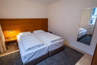 Ein Bett oder Betten in einem Zimmer der Unterkunft EQbase Vienna City Apartments