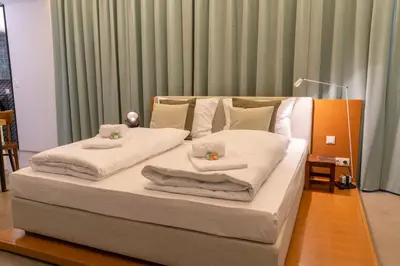 Ein Bett oder Betten in einem Zimmer der Unterkunft AWerner Suites Belvedere - Der Schlosser