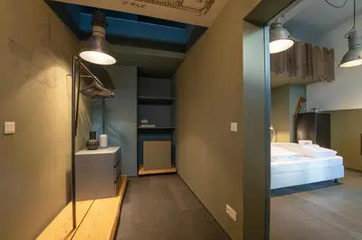 Ein Bett oder Betten in einem Zimmer der Unterkunft AWerner Suites Belvedere - Der Tischler