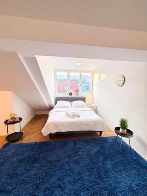 Ein Bett oder Betten in einem Zimmer der Unterkunft Simply Five Apartment