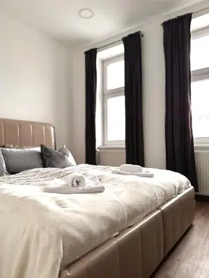 Ein Bett oder Betten in einem Zimmer der Unterkunft X Apartment Vienna