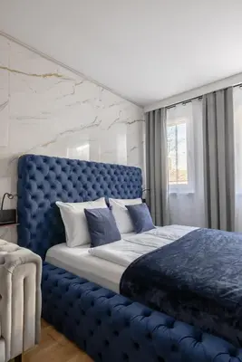 Ein Bett oder Betten in einem Zimmer der Unterkunft EA- Design Apartment nähe Hauptplatz