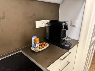 Küche/Küchenzeile in der Unterkunft Modernes Studio Apartment im Stadtzentrum 16