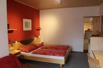 Ein Bett oder Betten in einem Zimmer der Unterkunft Gästehaus Karassowitsch