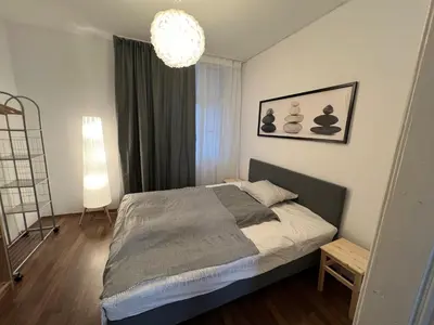 Ein Bett oder Betten in einem Zimmer der Unterkunft Charming new apartment in Vienna next to Stadthalle