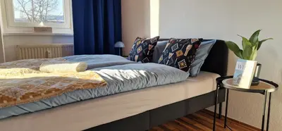 Ein Bett oder Betten in einem Zimmer der Unterkunft MALA Modern Vienna Flair Apartment Donaustadt