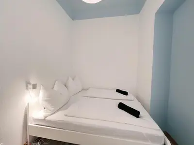 Ein Bett oder Betten in einem Zimmer der Unterkunft Family & Friends Apartment at Stadthalle