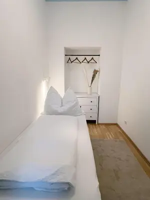 Ein Bett oder Betten in einem Zimmer der Unterkunft Family & Friends Apartment at Stadthalle
