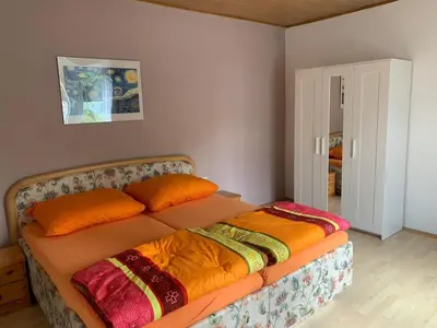 Ein Bett oder Betten in einem Zimmer der Unterkunft Comfortable, family-friendly and top located