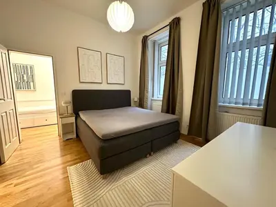 Ein Bett oder Betten in einem Zimmer der Unterkunft Belvedere Central Station Apartment