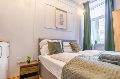 Ein Bett oder Betten in einem Zimmer der Unterkunft Multiple Apartments and Rooms at The Heart of Vienna