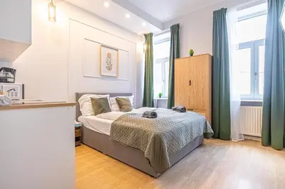 Ein Bett oder Betten in einem Zimmer der Unterkunft Multiple Apartments and Rooms at The Heart of Vienna