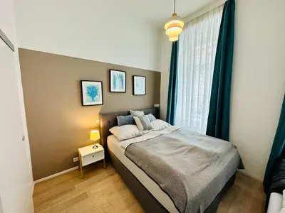 Ein Bett oder Betten in einem Zimmer der Unterkunft Panda Apartment