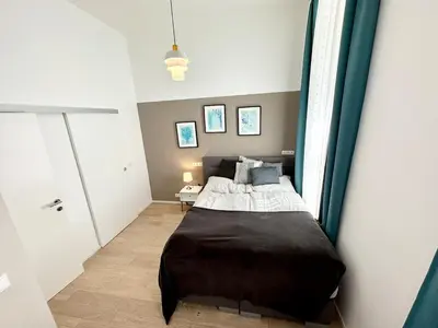 Ein Bett oder Betten in einem Zimmer der Unterkunft Panda Apartment