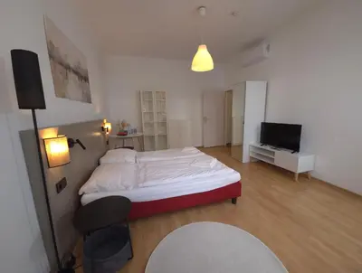 Ein Bett oder Betten in einem Zimmer der Unterkunft Aparthotel Amelie