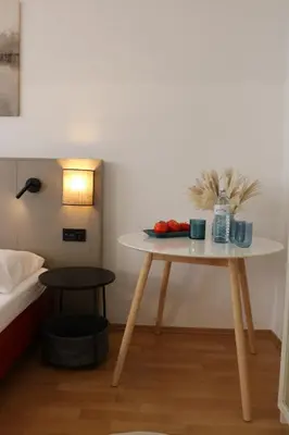 Ein Bett oder Betten in einem Zimmer der Unterkunft Aparthotel Amelie