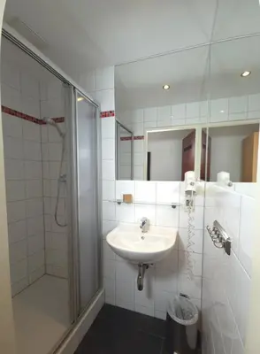 Ein Badezimmer in der Unterkunft Aparthotel Amelie